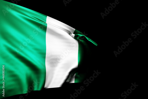 3D illustration of the national flag of Nigeria. on a metal flagpole fluttering against the blacl isolated background. Country symbol. photo