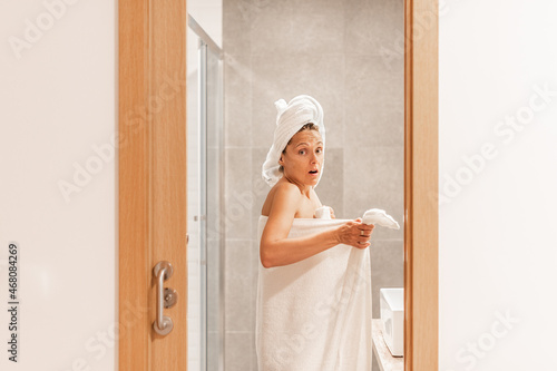 Photography Surprised woman caught unawares in bathroom after taking a shower