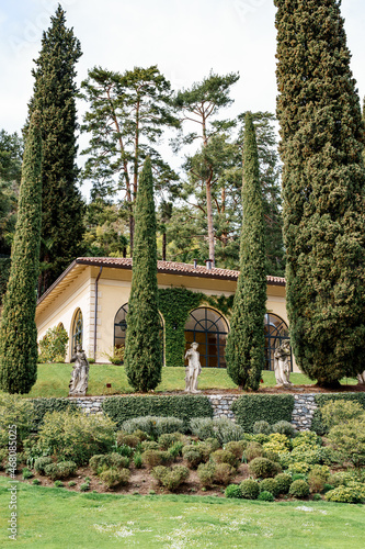 Tall cypress trees in the park at Villa Balbianello. Lake Como, Italy © Nadtochiy