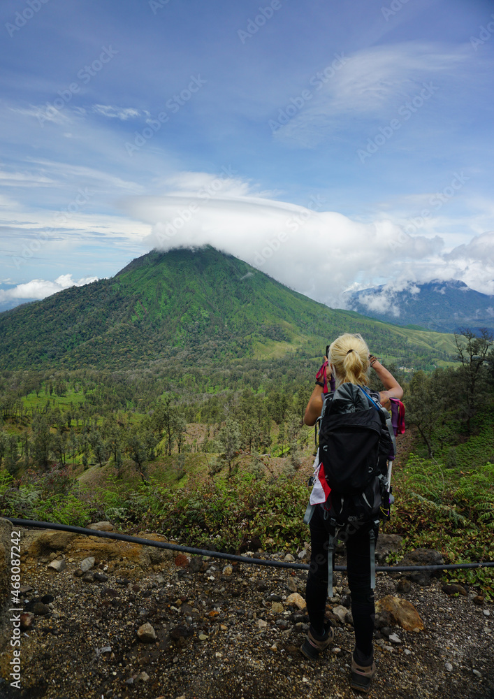 A woman hiking at mount Ijen in Banyuwangi Indonesia.