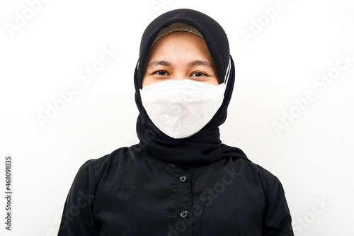 Closeup of beautiful young Muslim woman wearing white mask, corona, covid-19, isolated