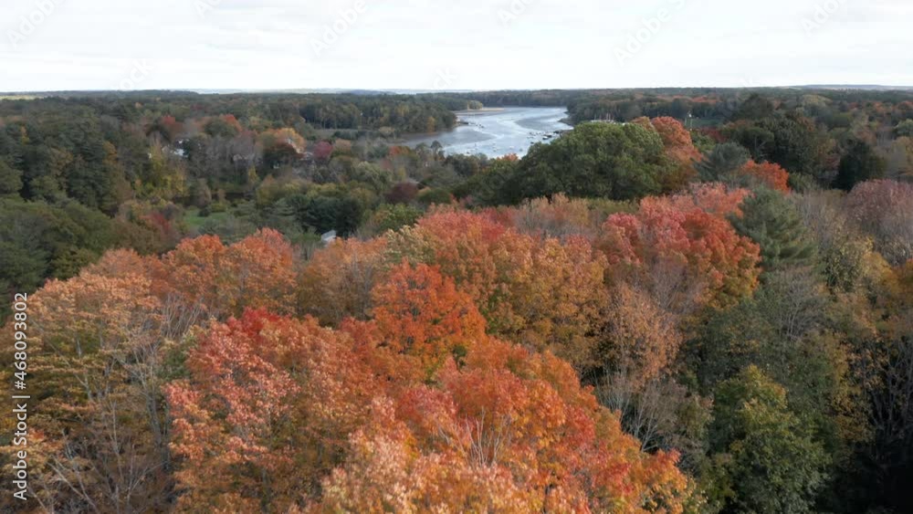 Beautiful autumn aerial shot panning up to reveal the Royal River running through Yarmouth, Maine. Beautiful autumn aerial shot panning up to reveal the Royal River running through Yarmouth, Maine.