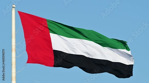 Slowmotion: The Flag of the United Arab Emirates waving in the air, The national symbol of The United Arab Emirates photo