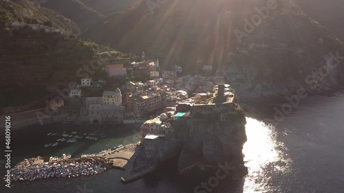 circulair droneshot over sea around a village italy at the italian coast at sunrise 4k. photo