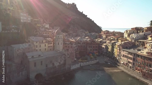 circulair droneshot of a coastline village in italy at sunrise 4k. photo