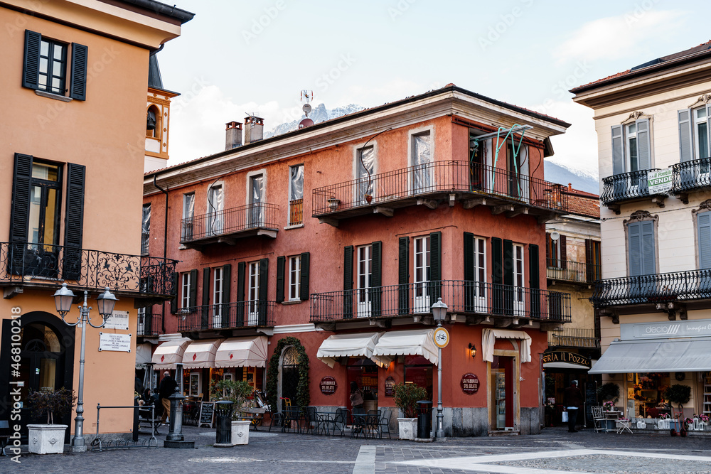Street in Menaggio with old houses with shutters and balconies. Como, Italy