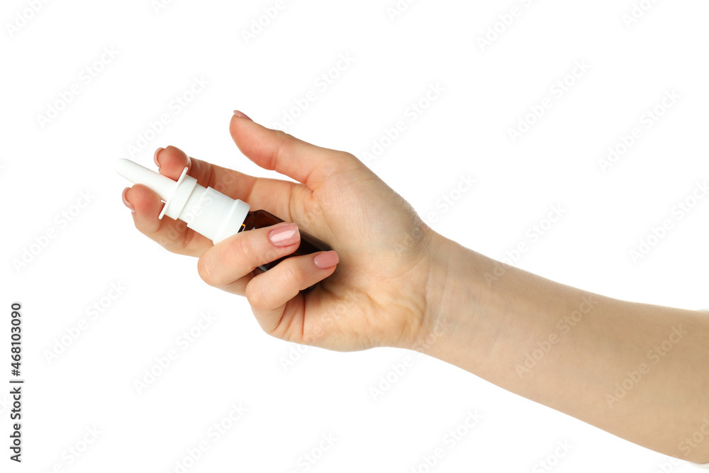 Female hand holds blank bottle of nasal spray, isolated on white background Female hand holds blank bottle of nasal spray, isolated on white background
