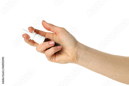 Female hand holds blank bottle of nasal spray, isolated on white background