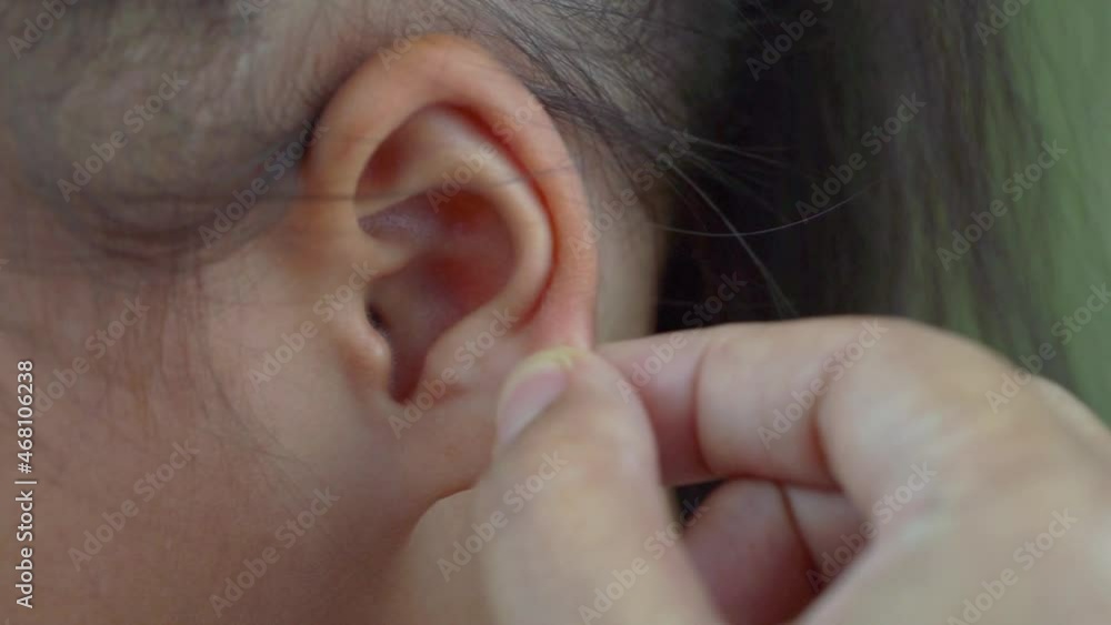 Asian mother and child girl playing pinch ear, touch nose funny face. Asian mother and child girl playing pinch ear, touch nose funny face.
