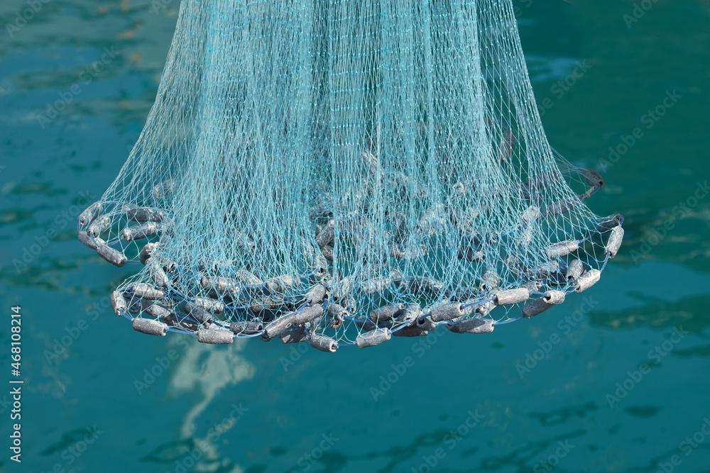 Fischernetz , Wurfnetz mit Senkblei Stock Photo