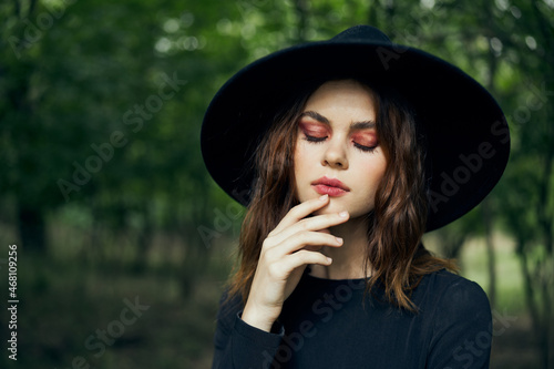woman dressed as a witch in the forest Halloween fantasy ritual © VICHIZH