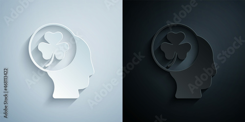 Paper cut Human head with clover trefoil leaf icon isolated on grey and black background. Happy Saint Patricks day. National Irish holiday. Paper art style. Vector