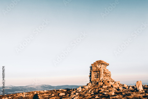 A stone obelisk on top of a mountain, Giant Mountains, Poland