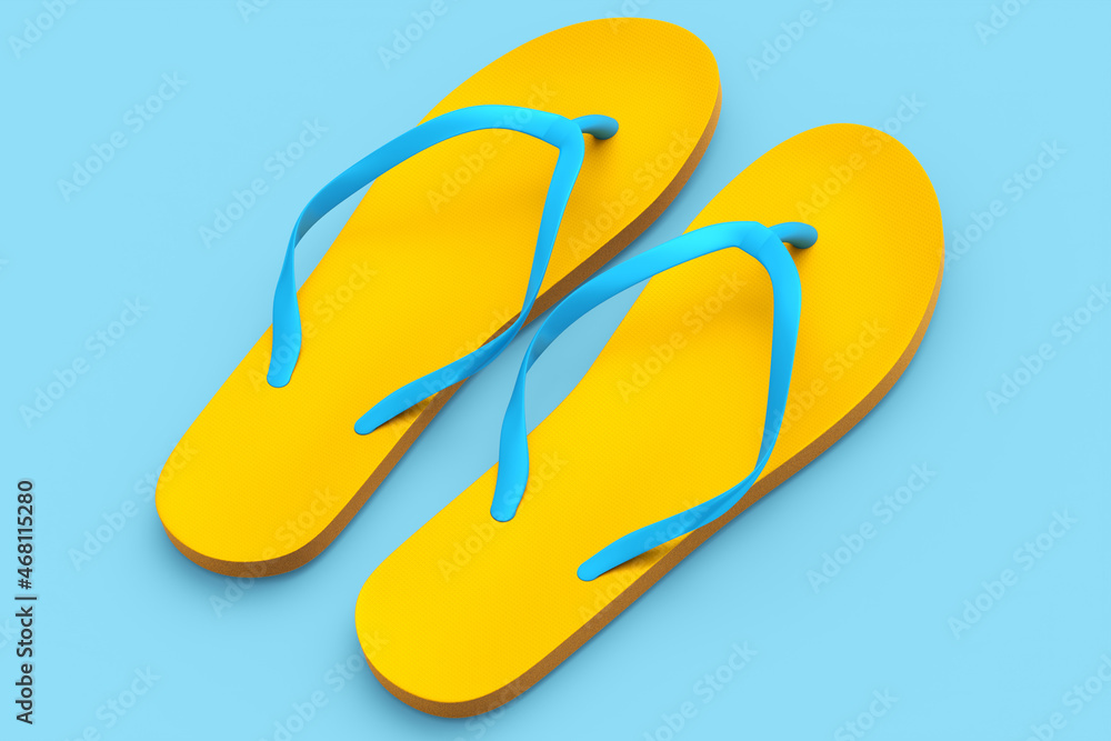 Beach orange flip-flops or sandals isolated on blue background. Beach orange flip-flops or sandals isolated on blue background.