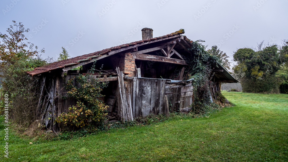 Old abandoned wooden barn in a meadow in Bresse, France Old abandoned wooden barn in a meadow in Bresse, France