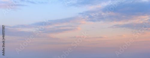Beautiful clouds in the twilight on clear sky. Banner © Elena