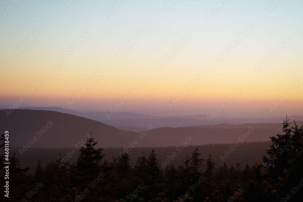Pink colors of sunset in mountains landscape view.