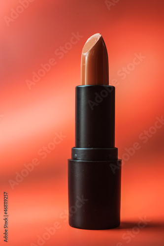 Close-up of lipstick on a red background