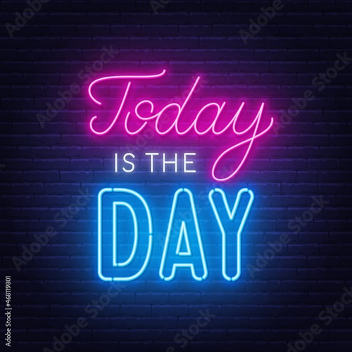 Today is the Day neon lettering on brick wall background.