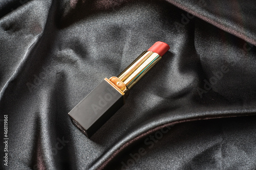 close-up of lipstick on black cloth background