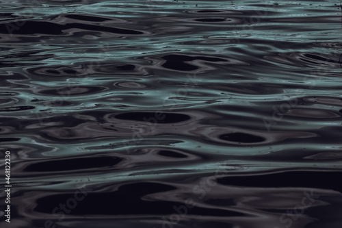 Background of dark waves on the lake with glare