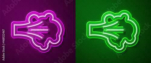 Glowing neon line Paint spray icon isolated on purple and green background. Vector