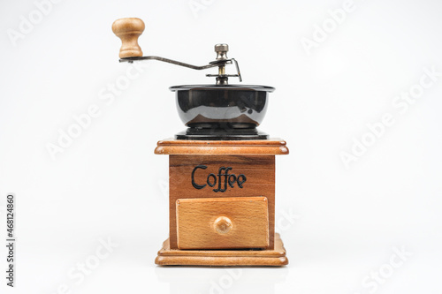 Image of making coffee. Coffee grinder on white background 