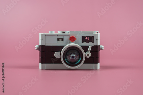small plastic camera on pink background