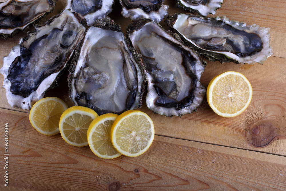 Oyster and lemon slices on table Oyster and lemon slices on table