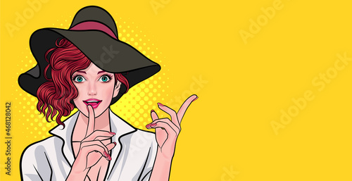smiling woman with big hat looking and point her hand finger on lips
