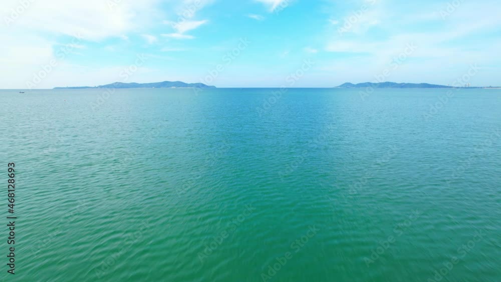 4K Aerial view of drone move on beautiful sea, Flight over ocean. Dynamic aerial shot. Perfect for holiday summer background. Drone 4k shot.
