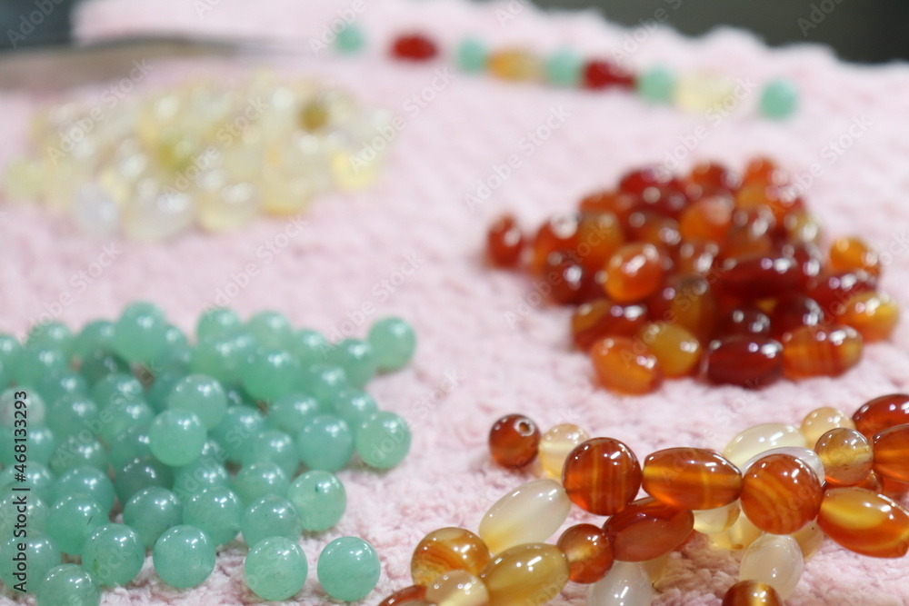 Natural Color gems stone on pink fabric. Golden smith and gems and jewelry Natural Color gems stone on pink fabric. Golden smith and gems and jewelry