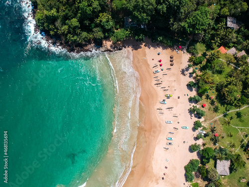 Tropical beach in Sri Lanka with boats from above