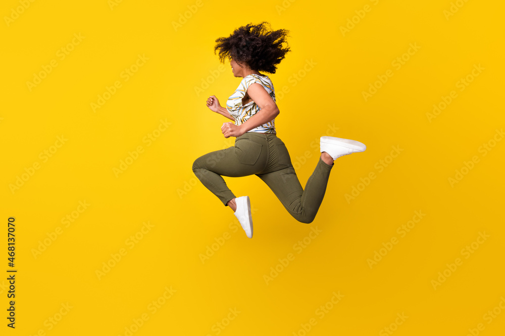 Back rear view full body photo of young afro girl go fast run sale jump printed blouse isolated over yellow color background - obrazy, fototapety, plakaty 