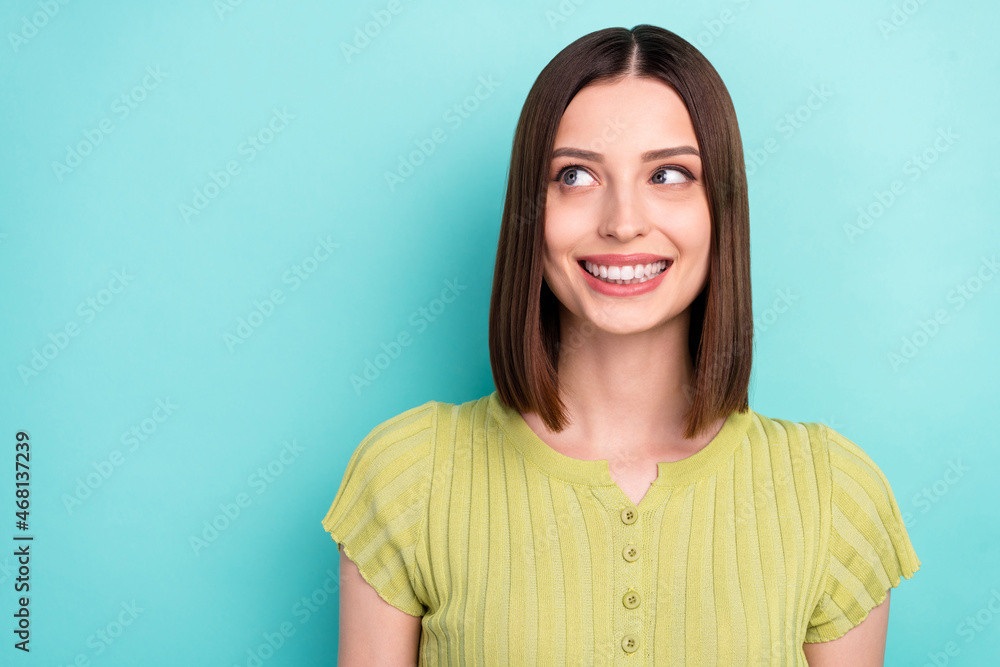 Obraz premium Photo of curious dreamy positive lady look empty space wear green blouse isolated turquoise color background