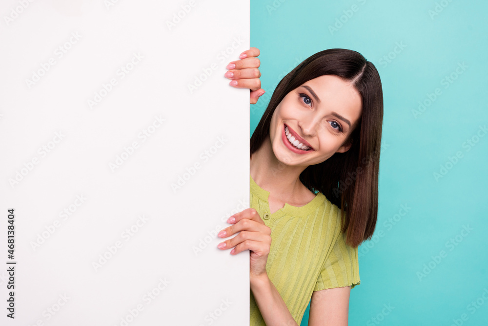 Photo of funny cheerful cute lady empty space white wall banner place wear green blouse isolated teal color background Photo of funny cheerful cute lady empty space white wall banner place wear green blouse isolated teal color background