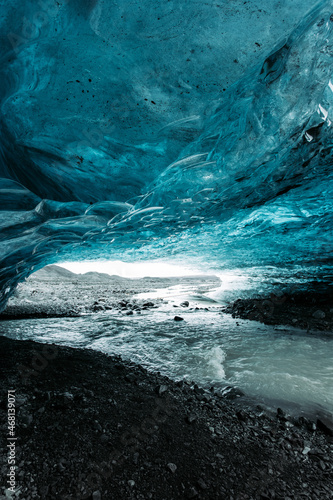 blue ice cave of Iceland glacier vertical photo