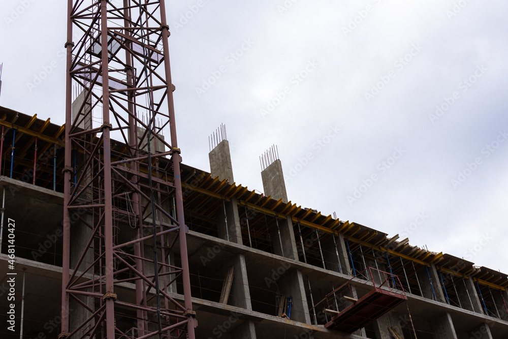Construction of a multi-storey building in the city, concrete walls with reinforcement