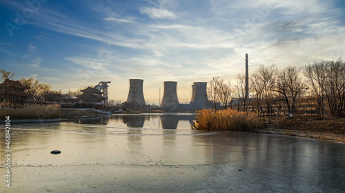 Cooling tower power plant in front of Shougang Park Lake