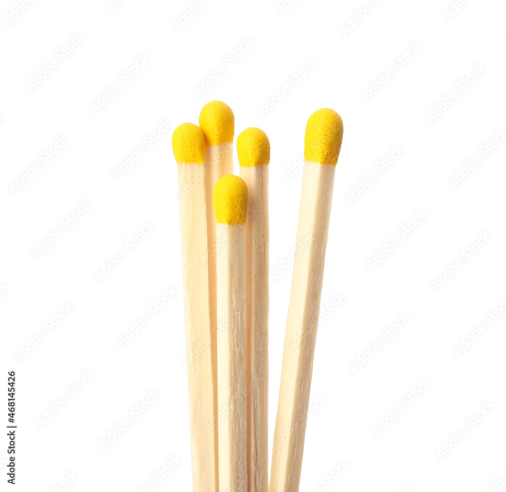 Matches with yellow heads on white background Matches with yellow heads on white background