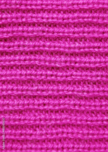 Closeup the Texture of Vivid Fuchsia Pink Knitted Wool Fabric in Horizontal Patterns