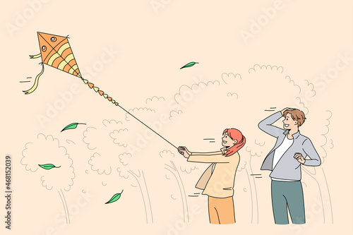 Happy father and small daughter play with paper kite in park. Smiling dad have fun feel playful with game with little child on family weekend. Entertainment, leisure activity. Vector illustration. 