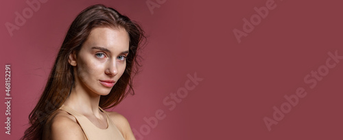 Wallpaper Mural Close-up portrait of young beautiful girl without makeup isolated over dark pink studio background. Natural beauty concept. Torontodigital.ca