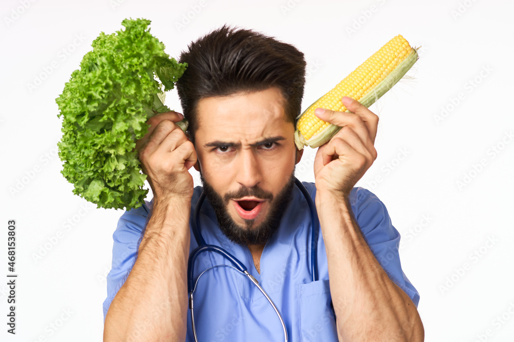 male nutritionist with vegetables in the hands of health calories male nutritionist with vegetables in the hands of health calories