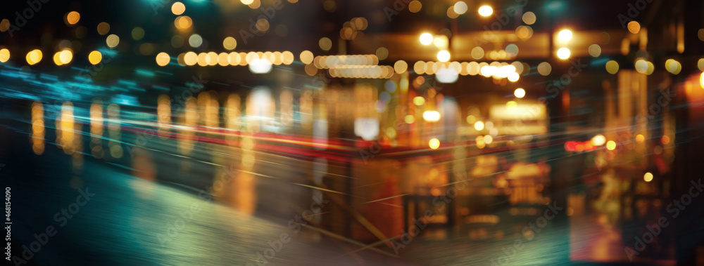 blur city lamp light of party for Christmas of vintage pub in dark city night abstract banner background. blur city lamp light of party for Christmas of vintage pub in dark city night abstract banner background.
