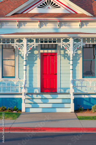 Front porch exterior with red front door at Oceanside  California