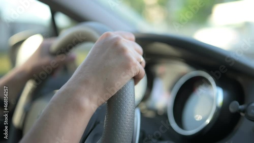 Wallpaper Mural Hands on car steering wheel during driving with blurred background. Person controls vihicle and moving on road Torontodigital.ca