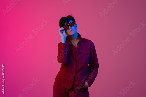 Mature european woman wearing sunglasses posing on camera © Drobot Dean