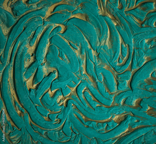 beautiful turquoise background with gold pattern close-up
