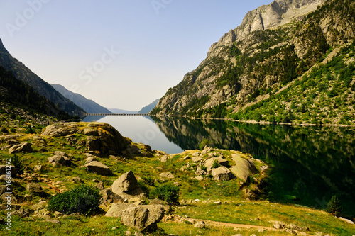 Spectacular reflections in the Estany de Cavallers of the Vall de Boí photo